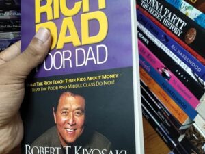 Rich Dad Poor Dad by Robert Kiyosaki and Sharon Lechter (Paperback/Hardcover